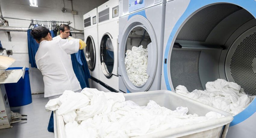 Modern self-service washing and drying machines at laundromat in Ireland