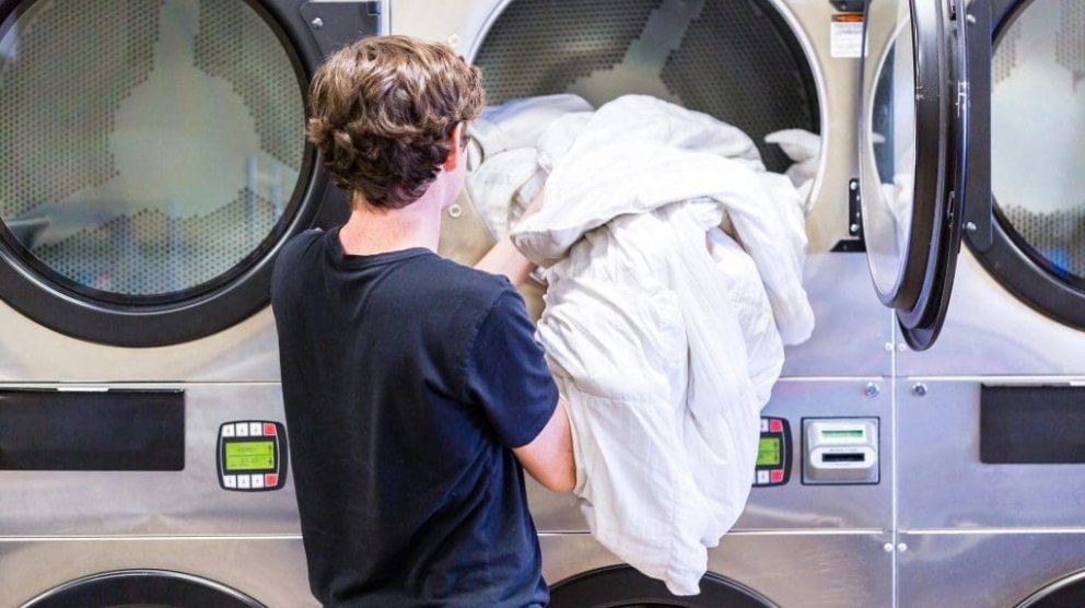 Modern self-service laundromat machines in Ireland/UK — washers and dryers